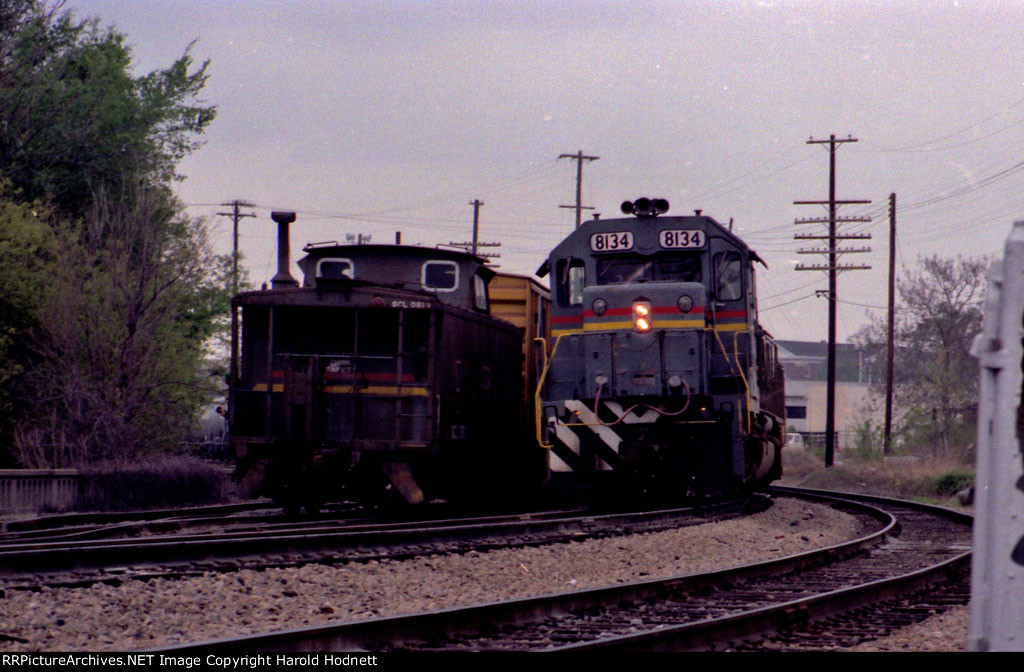 SBD 8134 passes the rear of another train